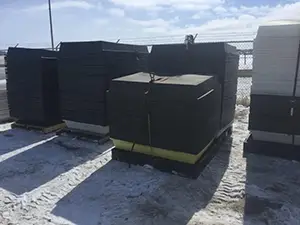 Stacks of nested spill containment trays