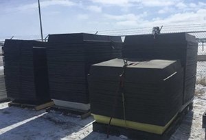 stacks of nested spill containment trays